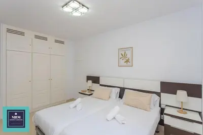 Cama o camas de una habitación en Martina Apartment Las Canteras-Auditorio