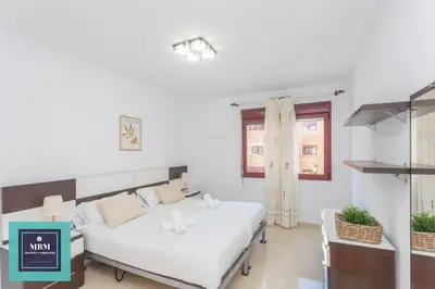 Cama o camas de una habitación en Martina Apartment Las Canteras-Auditorio