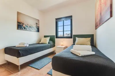 Cama o camas de una habitación en Residencial Las Candelarias 35