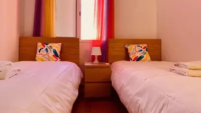 Cama o camas de una habitación en Casa de Las Flores