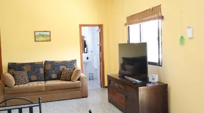 Una televisión o centro de entretenimiento en Casa rural Finca Don Amado, San Mateo