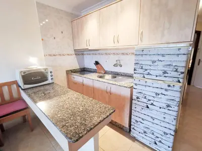 Una cocina o zona de cocina en Acogedor Apartamento ALOE