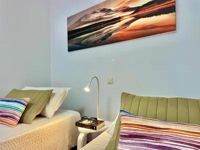 Cama o camas de una habitación en Bañaderos by SunHousesCanarias