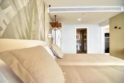 Cama o camas de una habitación en RELAXIA BEVERLY SUITES