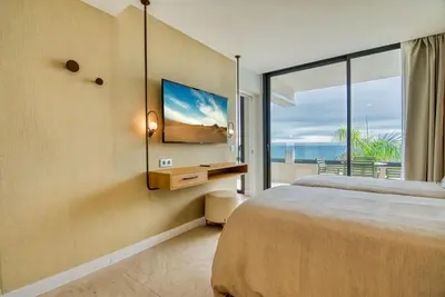 Cama o camas de una habitación en RELAXIA BEVERLY SUITES