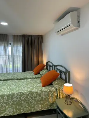 Cama o camas de una habitación en Oasis Playa Maspalomas