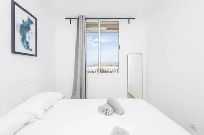 Cama o camas de una habitación en GuestReady - Balcon de Amadores 610