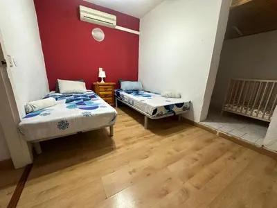 Cama o camas de una habitación en La casita de Ángela
