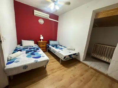 Cama o camas de una habitación en La casita de Ángela