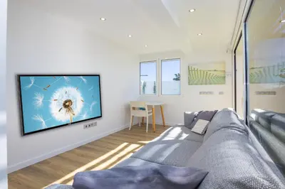 Una televisión o centro de entretenimiento en Mimosas suites