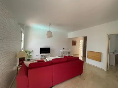 Una televisión o centro de entretenimiento en Deluxe Ciudad Jardin - by Gestión Vacacional Canarias