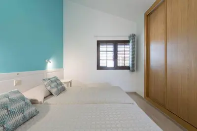 Cama o camas de una habitación en Cozi Bungalow in Maspalomas