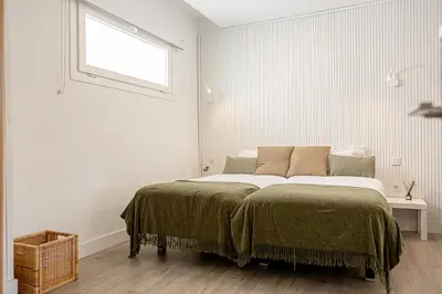 Cama o camas de una habitación en Bambú Suites Vegueta Alquiler por Habitación