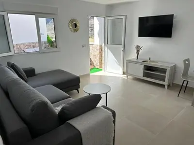 Una televisión o centro de entretenimiento en Apartamentos Casa Mime