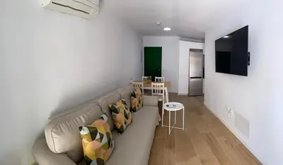 Una televisión o centro de entretenimiento en Las olas 214