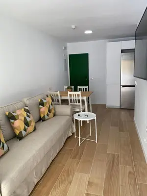 Una televisión o centro de entretenimiento en Las olas 214