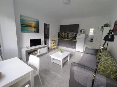 Una televisión o centro de entretenimiento en Apartamento Brisa Marina