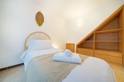 Cama o camas de una habitación en Villa Carolina - Dos terrazas privadas y acceso a piscina