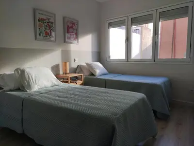 Cama o camas de una habitación en Atlantica Suite Las Canteras with Parking