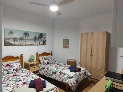 Cama o camas de una habitación en Casa Plaza San Nicolás de Bari