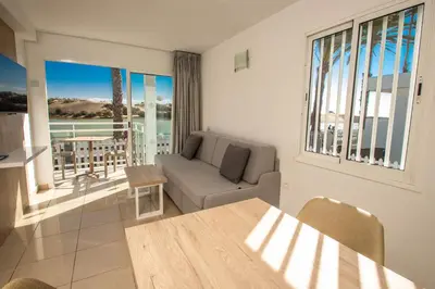 Zona de estar de Apartamentos Cocoteros