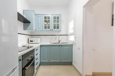 Una cocina o zona de cocina en Home2Book Stunning Sea Front Apartment La Garita