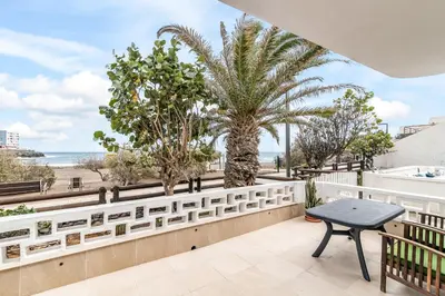 Un balcón o terraza de Home2Book Stunning Sea Front Apartment La Garita