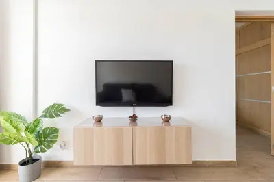 Una televisión o centro de entretenimiento en EMIL APARTMENT - Agaete Parque