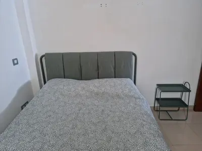 Cama o camas de una habitación en Vivienda 1ª línea mar en paseo marítimo