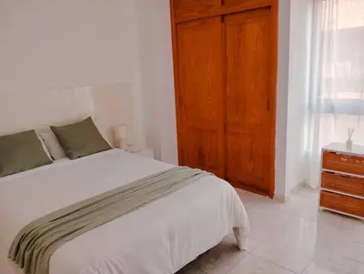 Cama o camas de una habitación en Maravillosa vivienda junto al mar