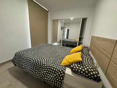 Cama o camas de una habitación en Estupendo apartamento con dos dormitorios