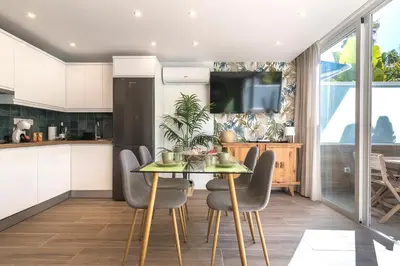 Una cocina o zona de cocina en Home2Book Stylish Tropical Apt Terrace & Pool