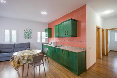 Una cocina o zona de cocina en Balcon de la Mina Suites - AirCon and Terrace with views