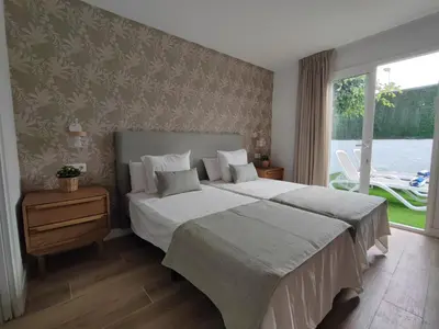 Cama o camas de una habitación en Bungalow con jardín privado junto al Yumbo