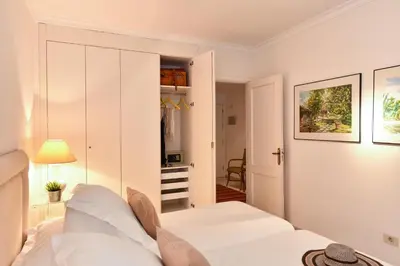 Cama o camas de una habitación en Las Canteras Seafront Apartment by VillaGranCanaria