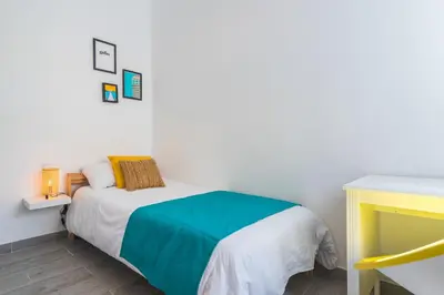 Cama o camas de una habitación en Home2Book Las Canteras Beach House