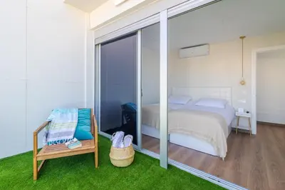 Cama o camas de una habitación en Luxury Beach Terrace Loft