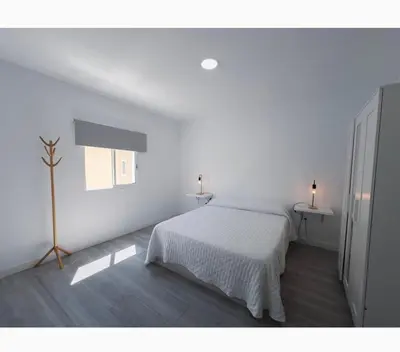 Cama o camas de una habitación en Paraíso Playa de Arinaga