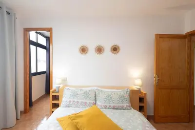 Cama o camas de una habitación en GuestReady - BKD2 A tan solo 50 metros de la playa Las Canteras