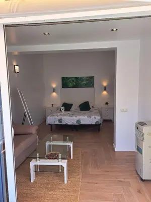 Cama o camas de una habitación en Agréable bungalow avec grande terrasse et piscine