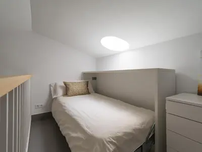 Cama o camas de una habitación en Amazing 3 bedroom next to the beach with heated pool