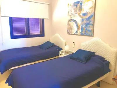 Cama o camas de una habitación en Beach and golf 4 Bedroom Holiday Home