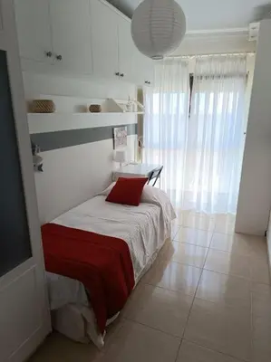 Cama o camas de una habitación en Apartamento en Arinaga en primera linea