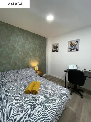 Cama o camas de una habitación en CoLiving El Juanito