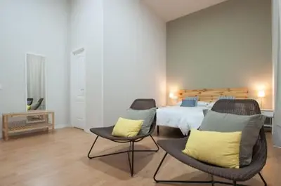 Cama o camas de una habitación en Triana 103 Rooms & Suites