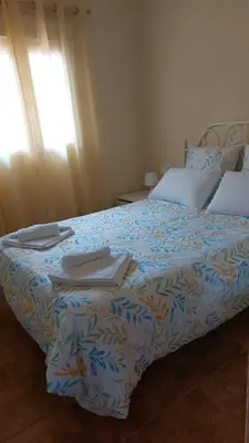 Cama o camas de una habitación en La casa de los naranjos