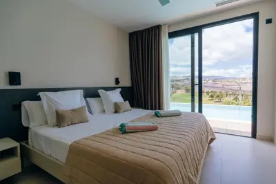 Cama o camas de una habitación en Villa Calima by Homestaygrancanaria