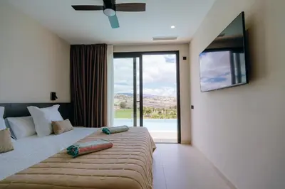 Cama o camas de una habitación en Villa Calima by Homestaygrancanaria