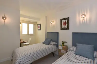 Cama o camas de una habitación en El Balcon Azul de Taliarte by VillaGranCanaria