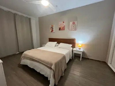 Cama o camas de una habitación en Agaete Playa vista Yumbo Dunas parking